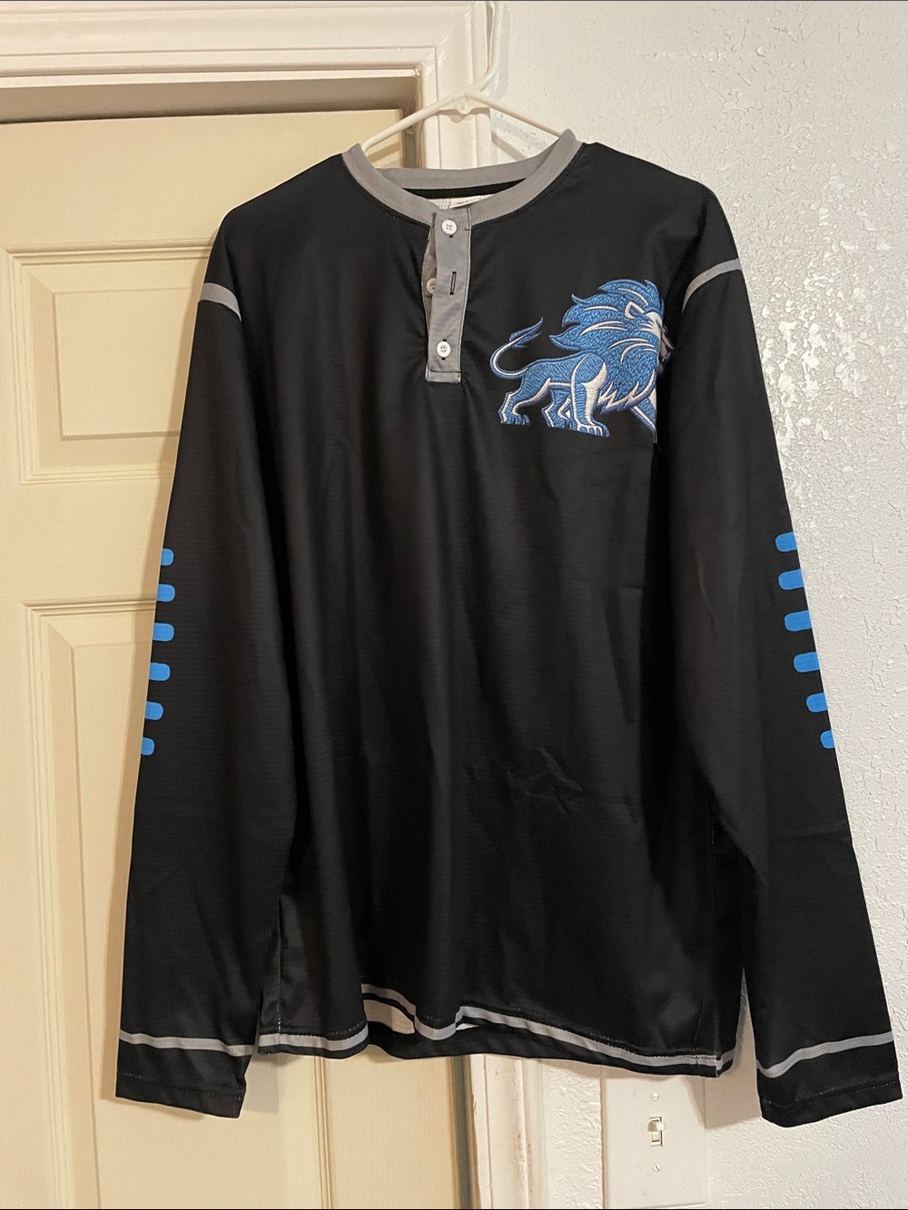 Black Long Sleeve with Blue Detroit Lions Graphic with Football threaded sleeves